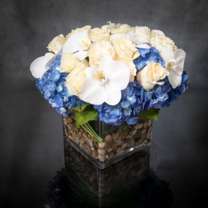 Beverly Hills Florist presents same day delivery for our "Heart of the Sea". light blue Hydrangeas, white Phalaenopsis Orchids, and beautiful white Roses. It’s a gift that celebrates the carefree spirit of summer, while surprising the people you care about most. Thank you flowers, Get well soon flowers, thinking of you flowers, thank you flowers!