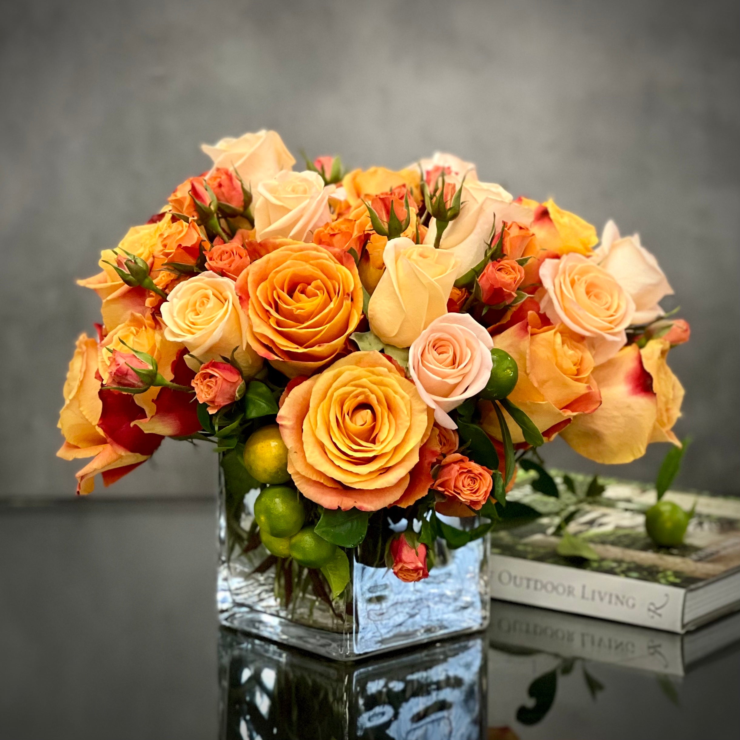 Blooms of Sunshine - Elegant Citrus Delight arrangement featuring vibrant flowers in a handcrafted 11-inch round design, perfect for brightening any space.