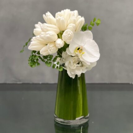 Our Free-Form Tulips from Beverly Hills Florist can be arranged for same day delivery ! My Beverly Hills Florist presents a dramatic display of Dutch Tulips and a single Orchid in a Cone glass vase. This stunning composition gives a unique and stylish look to any space.