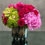 This delightful arrangement presented by Beverly Hills Florist is an artistic combination of pink floral favorites. Our team can arrange this piece to be delivered in the same day ! Our floral arrangement includes, Delicate Roses, Cymbidium Orchids, and wax flowers sit delicately atop a ceramic vase. A kind gesture for a Thank you or Love and Romance.