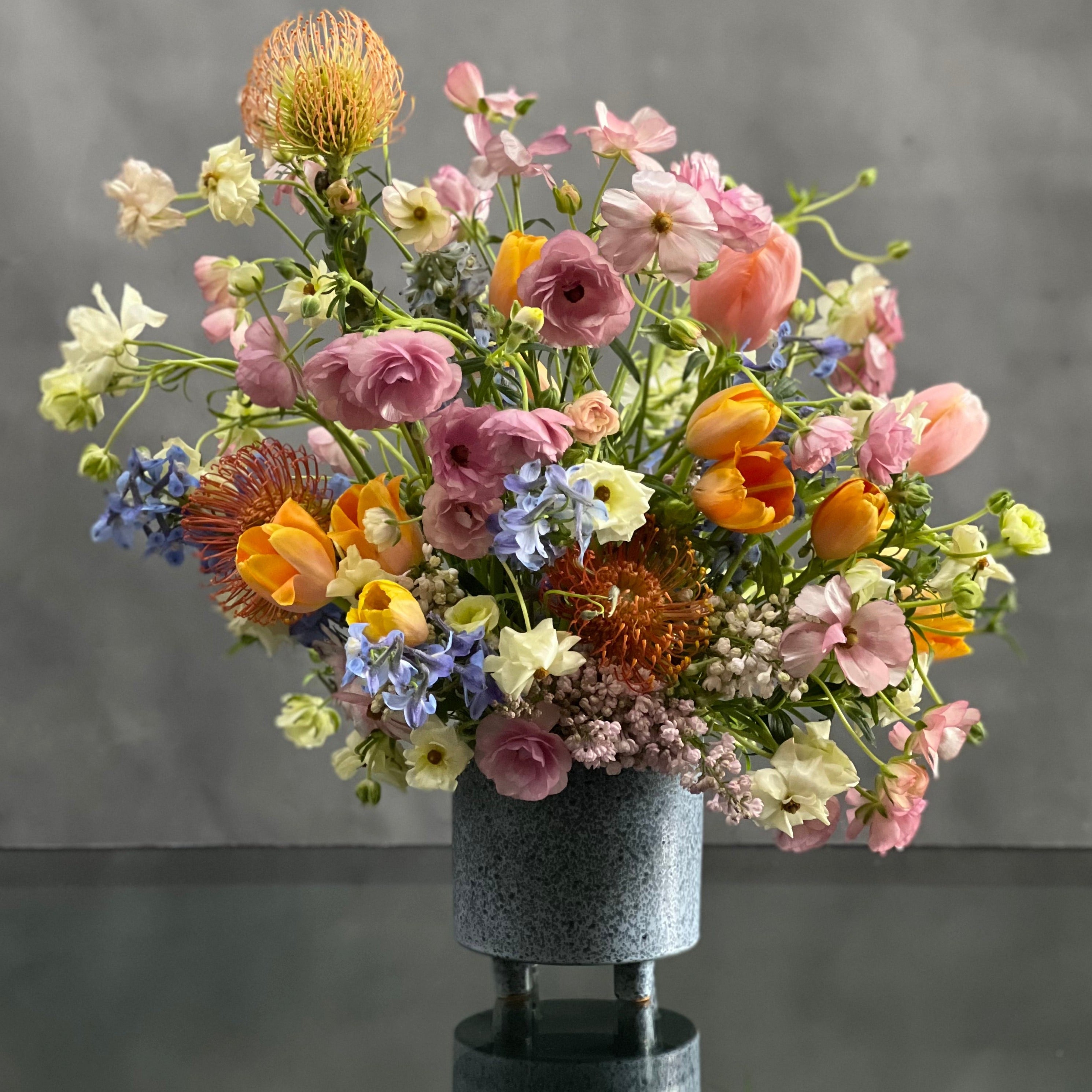 IMG_0040 My Beverly Hills Florist presents same day delivery for our Airy and Positively fun arrangement. This includes a beautiful variety of colorful seasonal florals. This piece includes Tulips and Hyacinths.