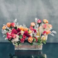 A beautiful presentation from our team at Beverly Hills Florist. A lovely creation of a  box of floral which includes, peach, pink and hot pink roses, dark pink hyacinths and a half bottle of Cote de Roses chardonnay. This gift is the ideal way to let someone know how much they mean to you. Love and Romance, Anniversary, Get Well