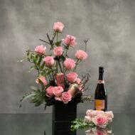 Beverly Hills Florist presents 2 dozen pink roses accented with greenery and branch in a black ceramic vase for same day delivery. Our product includes, Veuve Clicquot, bath salts, hand lotion and bath soap. A thoughtful love and romance gift, thank you gift and perfect for a nice celebration !