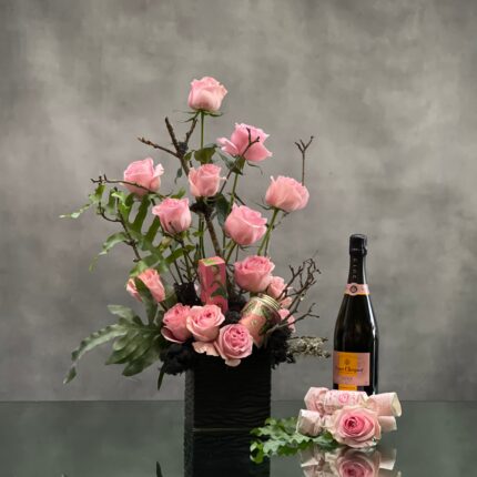 Beverly Hills Florist presents 2 dozen pink roses accented with greenery and branch in a black ceramic vase for same day delivery. Our product includes, Veuve Clicquot, bath salts, hand lotion and bath soap. A thoughtful love and romance gift, thank you gift and perfect for a nice celebration !