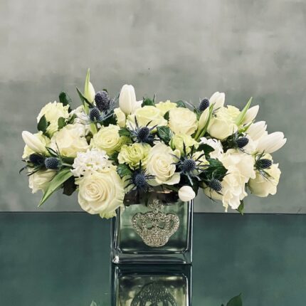 Beverly Hills Florist presents a variety of White Roses and Tulips, accented with Thistles in a silver vase. Made sure to shine with its bejeweled  crown ! Available for same day delivery. Making it a perfect fit for Love and Romance, Birthday or a thank you !