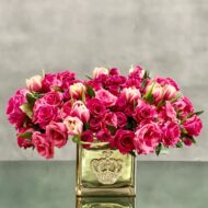 Beverly Hills Florist presents Sweet Mom of Mine for same day delivery ! A cluster of pink tulips and roses in a bejeweled crown gold glass vase. A beautiful notion of Love and Romance.