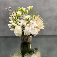 This arrangement is made with a designer's choice array of seasonal white flowers. Floral could include Roses, Hydrangeas, Orchids, Tulips and or Peonies. These beautiful white flowers are an excellent choice for weddings, funerals and other major life events. Our team at Beverly Hills Florist offers same day delivery!