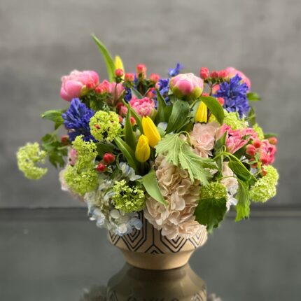 Beverly Hills Florist presents same day delivery for our Designers Choice - Spring. Let one of our talented designers put together a spring arrangement with seasonal flowers. This is a mix of vibrant summer flowers in a ceramic vase that is approximately 10" round. A beautiful notion of summer flower, thinking of you and a congratulations!