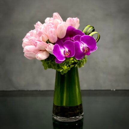 In life, there's always something to celebrate so don't allow the moment to pass! Beverly hills Florist presents Tiptoeing Through The Tulips for same day delivery!  Send this beautiful arrangement as a token of your affection. A lovely combination of pink Tulips joined together with an Orchid and seasonal accents is the perfect way to acknowledge any special occasion.