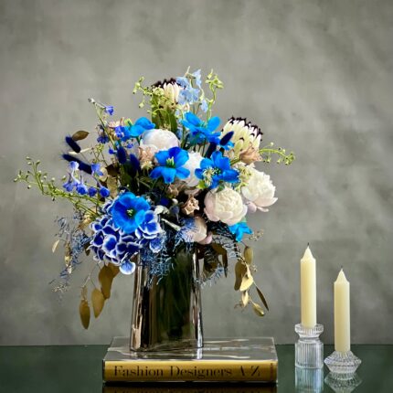 When your Monday's are feeling rather blue. Why not try this quiet little bouquet from  Beverly Hills Florist to bring a bit of serenity into your week with same day delivery service. This sure to never disappoint, these wonderful selections of blues tulips, white peonies, and white king protea are there to brighten even the gloomiest of days.