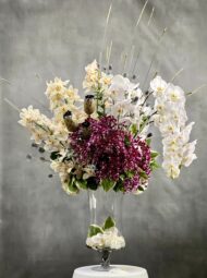 Beverly hills Florist presents Orchid bliss for same day delivery.. This piece includes, various white Orchids, Purple Phalaenopsis Orchids. Perfect for for Welcome flowers, extravagant events, Birthday flowers and more!