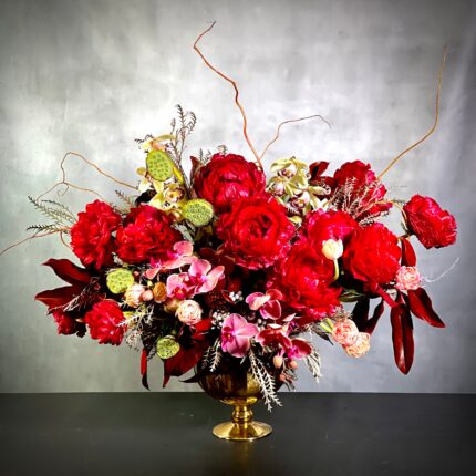 A beautiful centerpiece that connects Peonies and Tulips together, our team at Beverly Hills Florist can see to it that this arrangement is made and sent out in the same day. It adds texture to bring this arrangement to life. In this floral piece, we can see textures of not just Peonies and Tulips coming together but Cymbidium Orchids and Pomegranates as well. Perfect for Love and Romance, Birthday, Thinking of you, Holidays and more !