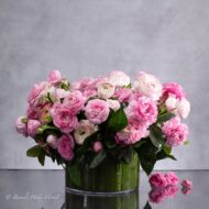 Modern Romance: Pink Ranunculus in a Cylinder of Grace - beverlyhillsflorist
