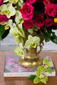 Amore Roses arrangement with red and pink Ecuadorian roses, spray roses, and orchids in a golden pedestal container, 40-inch round, elegant and romantic.