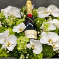 Beverly Hills Florist presents this luxury Moet floral box with orchids and other locally sourced flowers. 24 inch square box