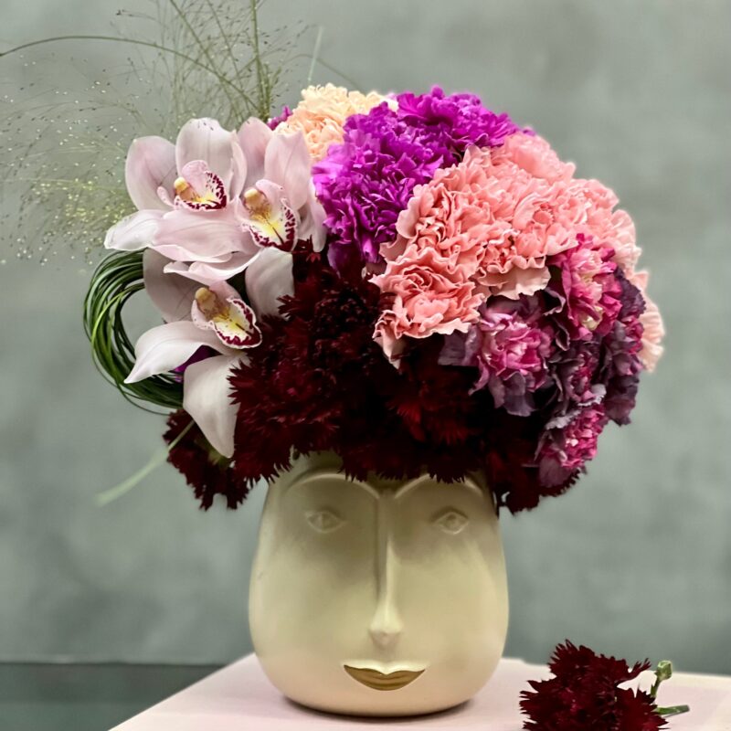 Beverly Hills Florist presents our "Funky Fresh" arrangement for same day delivery! A variety of colorful flowers accented with Orchids. A fun touch for a welcome home, birthday, office decor or a unique way of saying thank you.