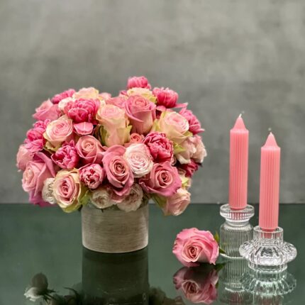 Our team at Beverly Hills Florist offers same day delivery. Our Amour arrangement is sure to put a smile on anyones face. A little bit of glamour with a whole lot of love! This floral piece includes various shades of pink Roses, pink Tulips placed in a 5x5 vase with silver textures. Beautifully made for, Birthdays, Thank you, Love & Romance & Thinking of you ! Approximately 25 Roses & 12 Tulips.