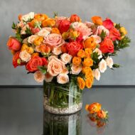 Peachy Sunset Floral Arrangement with Orange Roses and Peach Spray Roses
Elegant Ranunculus and Rose Arrangement in Glass Vase
Luxury Floral Arrangement for Same-Day Delivery Beverly Hills
Peachy Sunset Flower Arrangement for Los Angeles Delivery