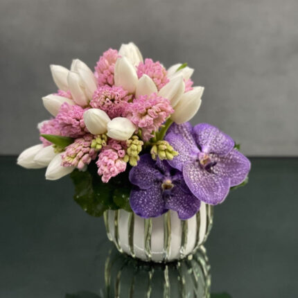 My Beverly Hills Florist offers same day delievery for this delicate piece that includes, Hyacinths, Tulips and Orchids. Beautifully arranged made for any event, Birthdays, Welcomes, Get well soon and baby welcome.