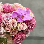 Vintage Pinks arrangement featuring 50 pink roses with orchid accents in a gold mirrored vase, available for same-day delivery by Beverly Hills Florist.