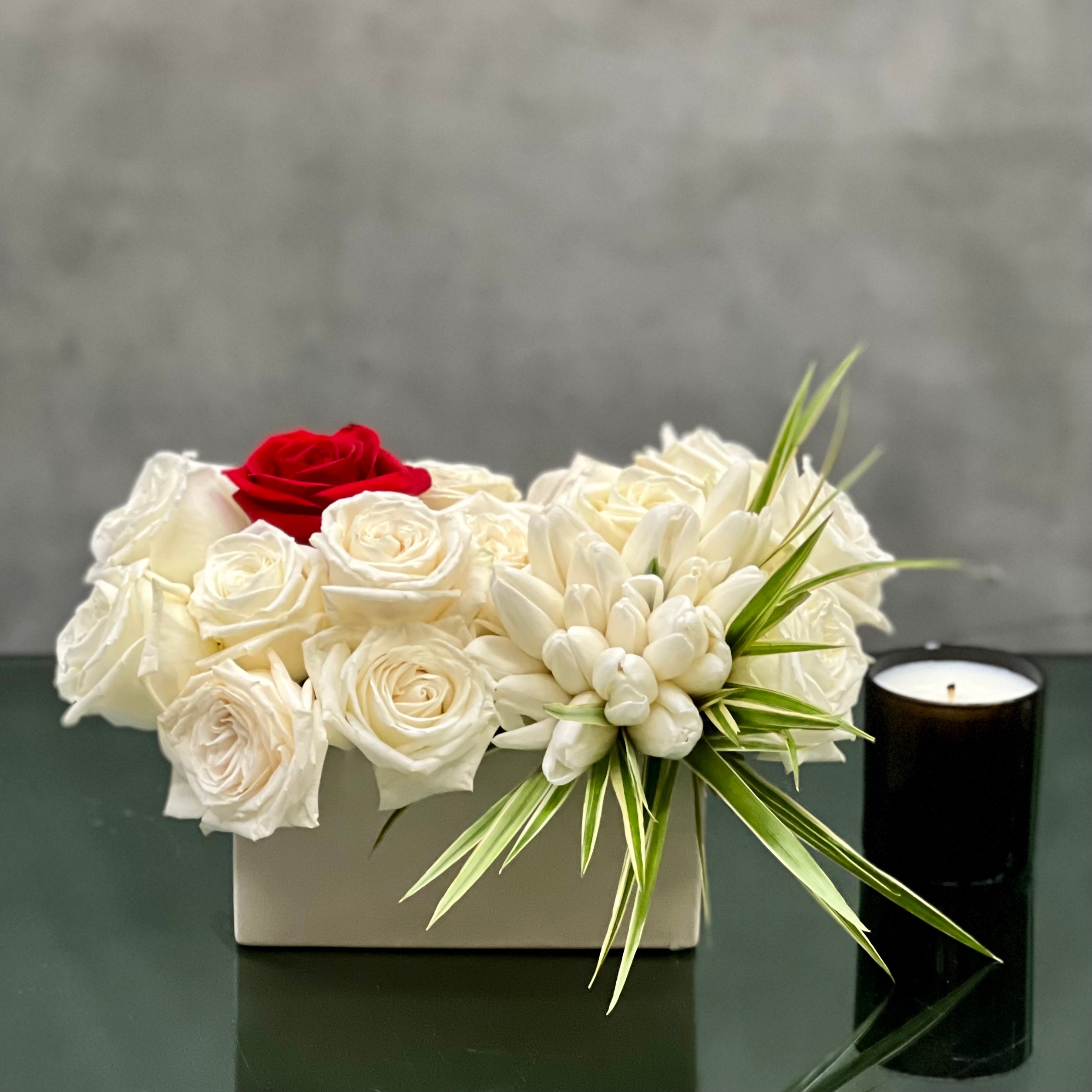 white_roses_white_tulips_red_rose Beverly Hills presents "Cupids Arrow" for same day delivery! Our arrangement prepared by our team includes 24 Roses, Bunches of Tulips & Various greens. This floral piece is sure to wow that someone special. It's wonderful for Love and Romance, Thinking of you & Just because!