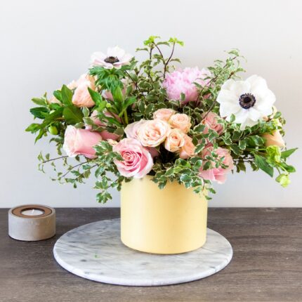 Our Portrait of a Lady bouquet delivers all the sweetness of spring. Beverly Hills Florist presents our wonderful arrangement for same day delivery ! A garden-fresh gathering of peach and pink Roses and Anemones in yellow container accented by wispy greens. It’s a gift full of warmth and happiness.